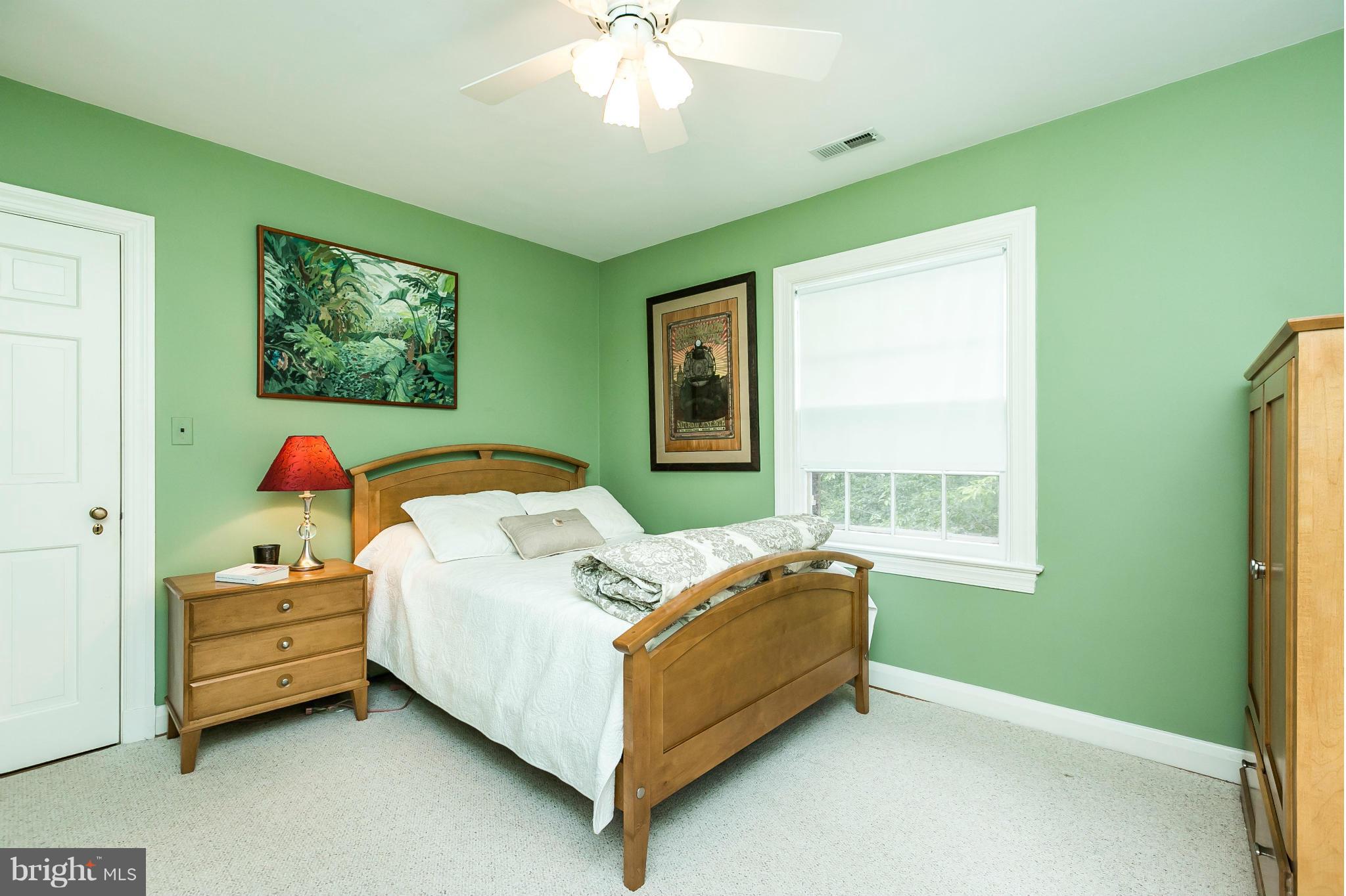 203 Midhurst Road Baltimore, MD 21212 - Photo 19 of 30 a bedroom with bed and a window