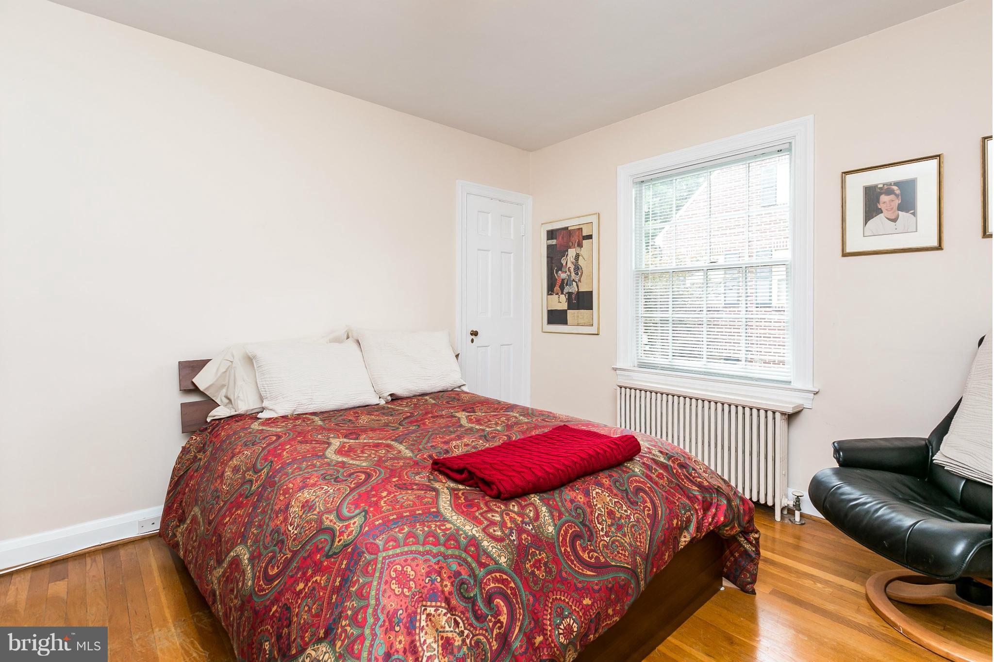 203 Midhurst Road Baltimore, MD 21212 - Photo 20 of 30 a bedroom with a bed and wooden floor