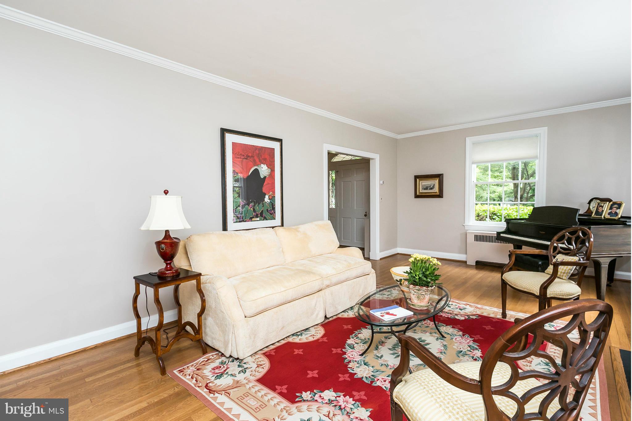 203 Midhurst Road Baltimore, MD 21212 - Photo 3 of 30 a bed room with a bed and a chair