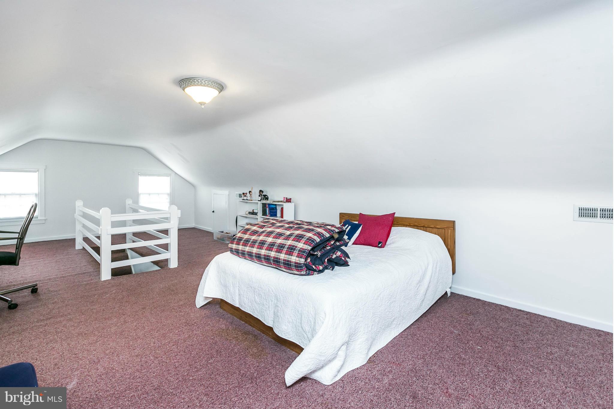 203 Midhurst Road Baltimore, MD 21212 - Photo 21 of 30 a bedroom with a bed and a couch