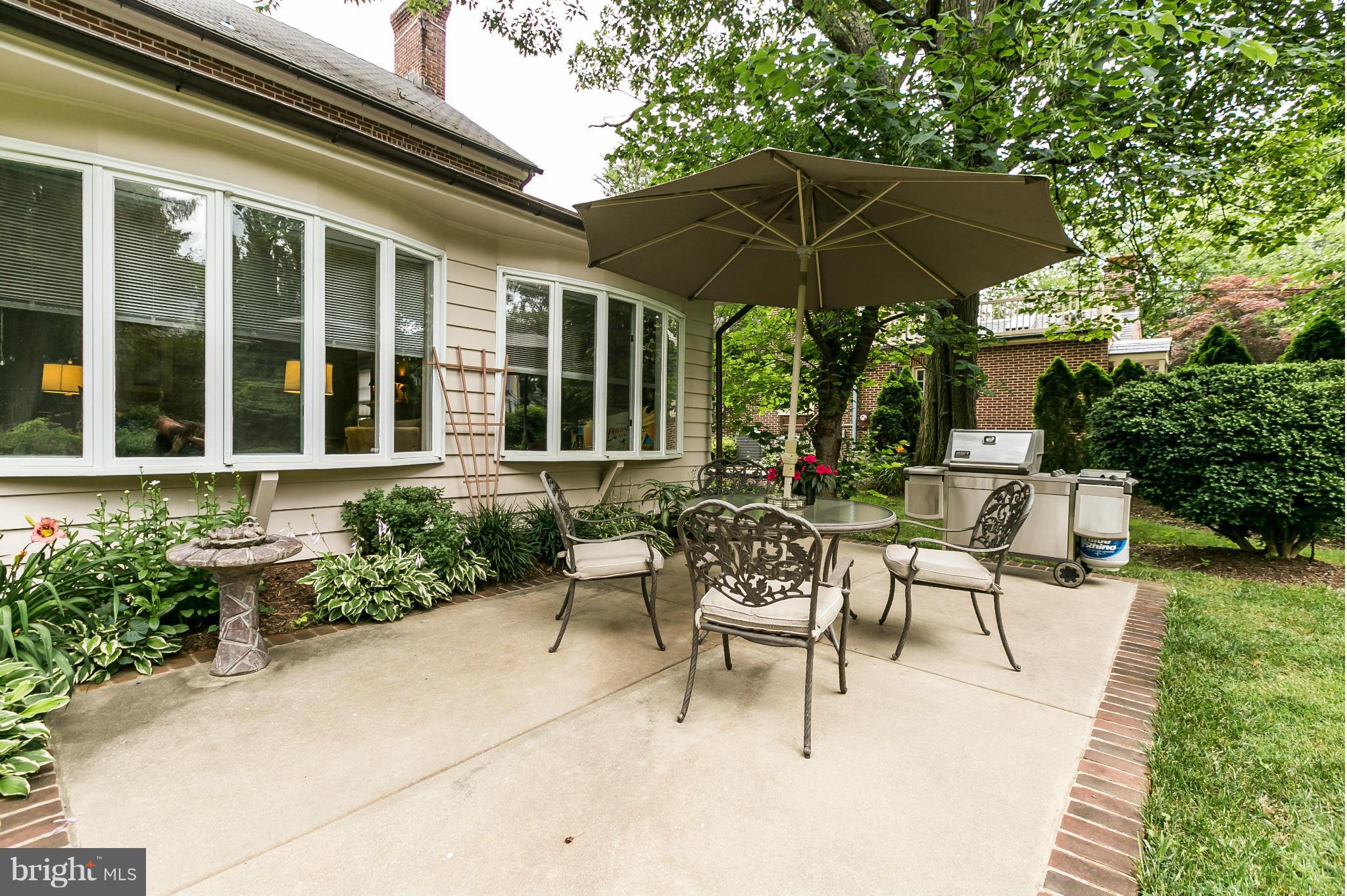 203 Midhurst Road Baltimore, MD 21212 - Photo 27 of 30 a view of a house with backyard sitting area and garden
