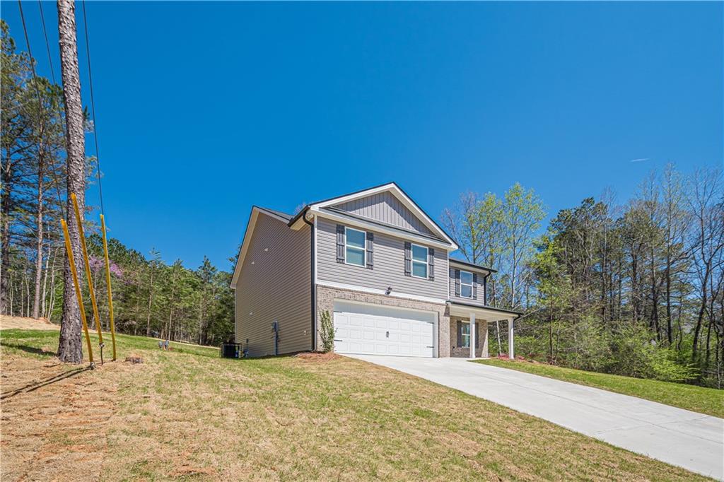 a front view of a house with a yard