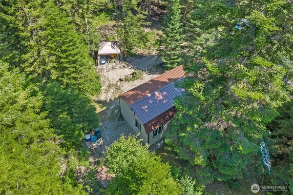 an aerial view of a house with a yard