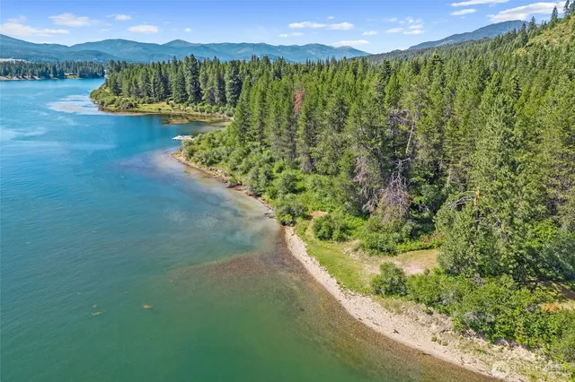 a view of a lake with houses in the back