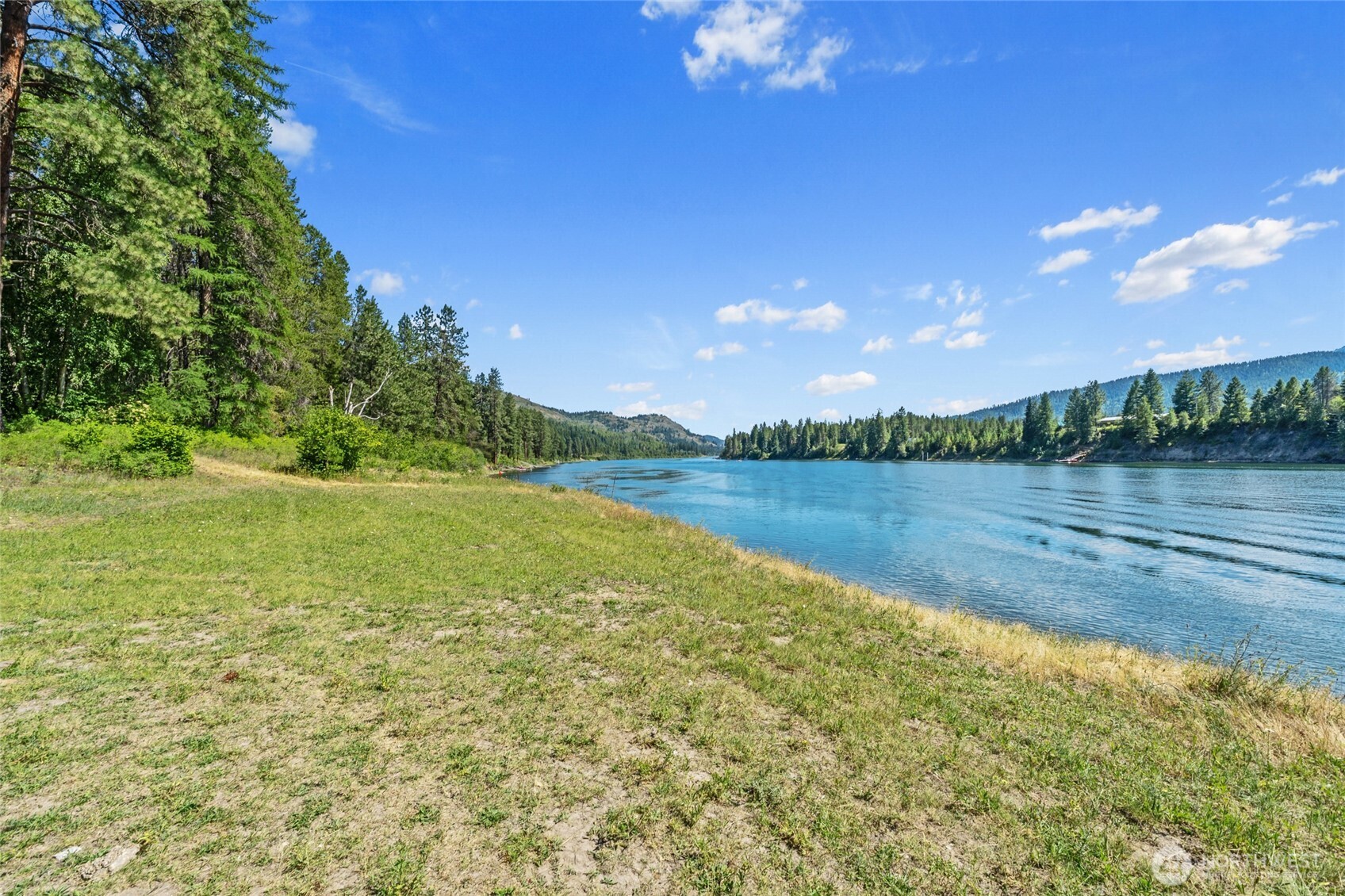 28922 LeClerc Road North Ione, WA 99139 - Photo 30 of 31 a view of a lake with houses in the back