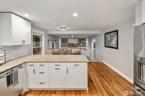 a living room with granite countertop furniture and painting on the wall