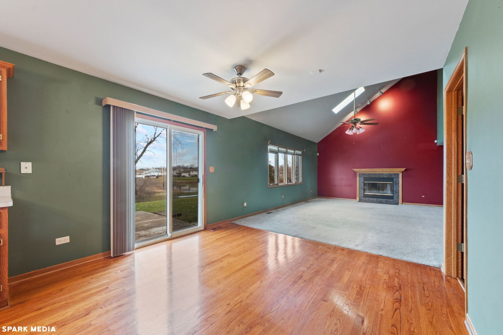 5642 Feather Creek Road Matteson, IL 60443 - Photo 11 of 36 a view of an empty room with a window and a kitchen