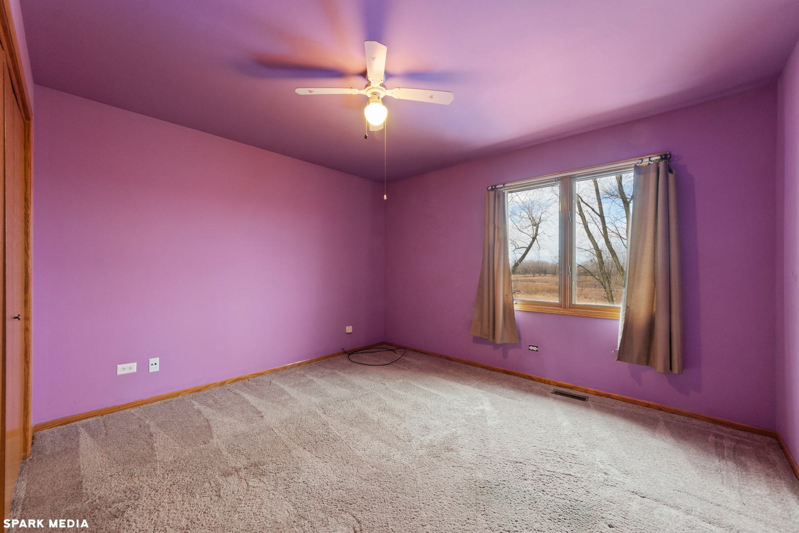 5642 Feather Creek Road Matteson, IL 60443 - Photo 20 of 36 a view of a livingroom with a ceiling fan and window