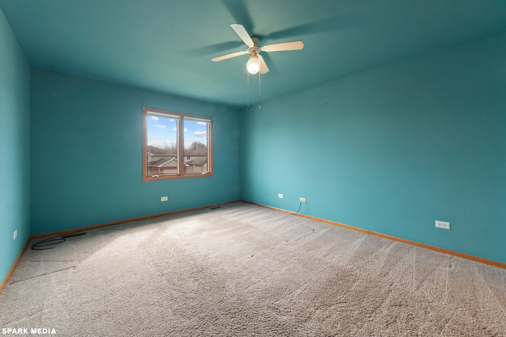 5642 Feather Creek Road Matteson, IL 60443 - Photo 21 of 36 an empty room with windows and a ceiling fan