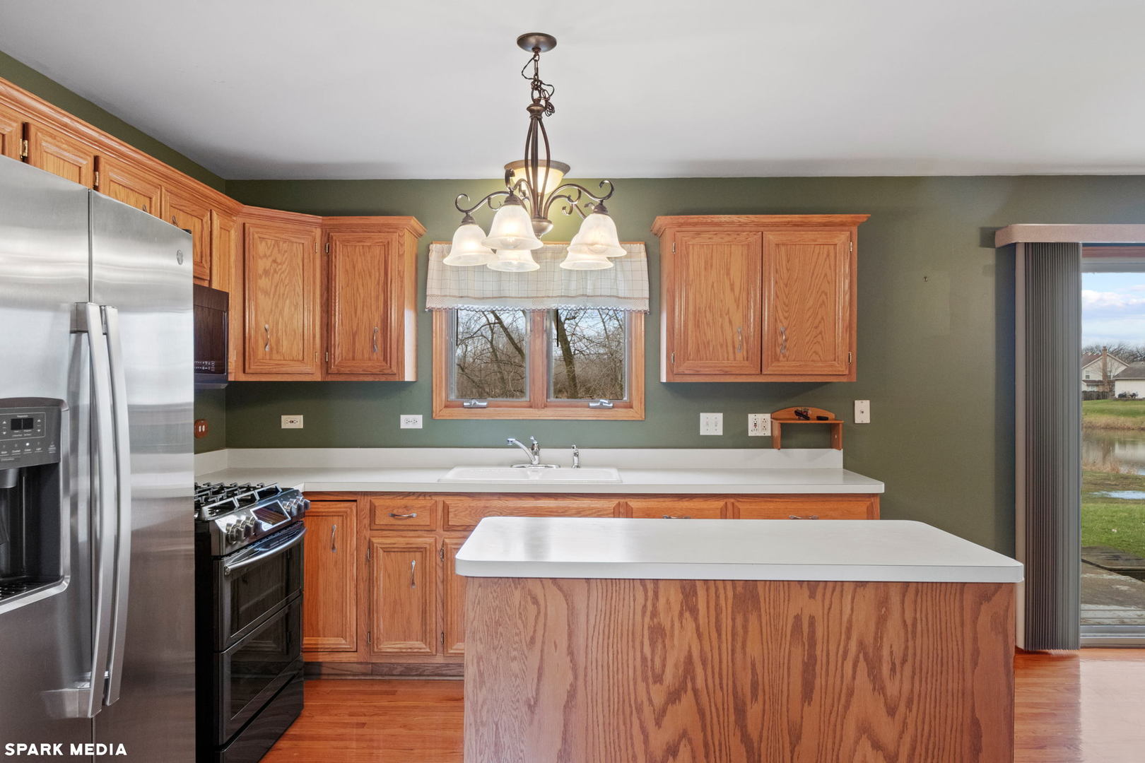 5642 Feather Creek Road Matteson, IL 60443 - Photo 8 of 36 a kitchen with stainless steel appliances granite countertop a sink stove and refrigerator