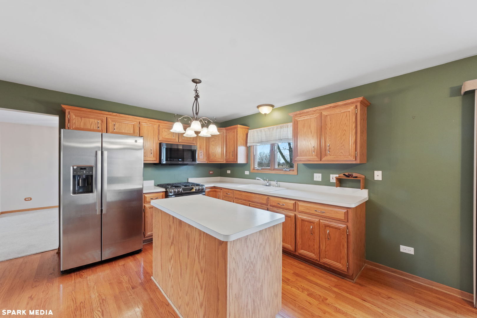 5642 Feather Creek Road Matteson, IL 60443 - Photo 9 of 36 a kitchen with stainless steel appliances a sink and a refrigerator