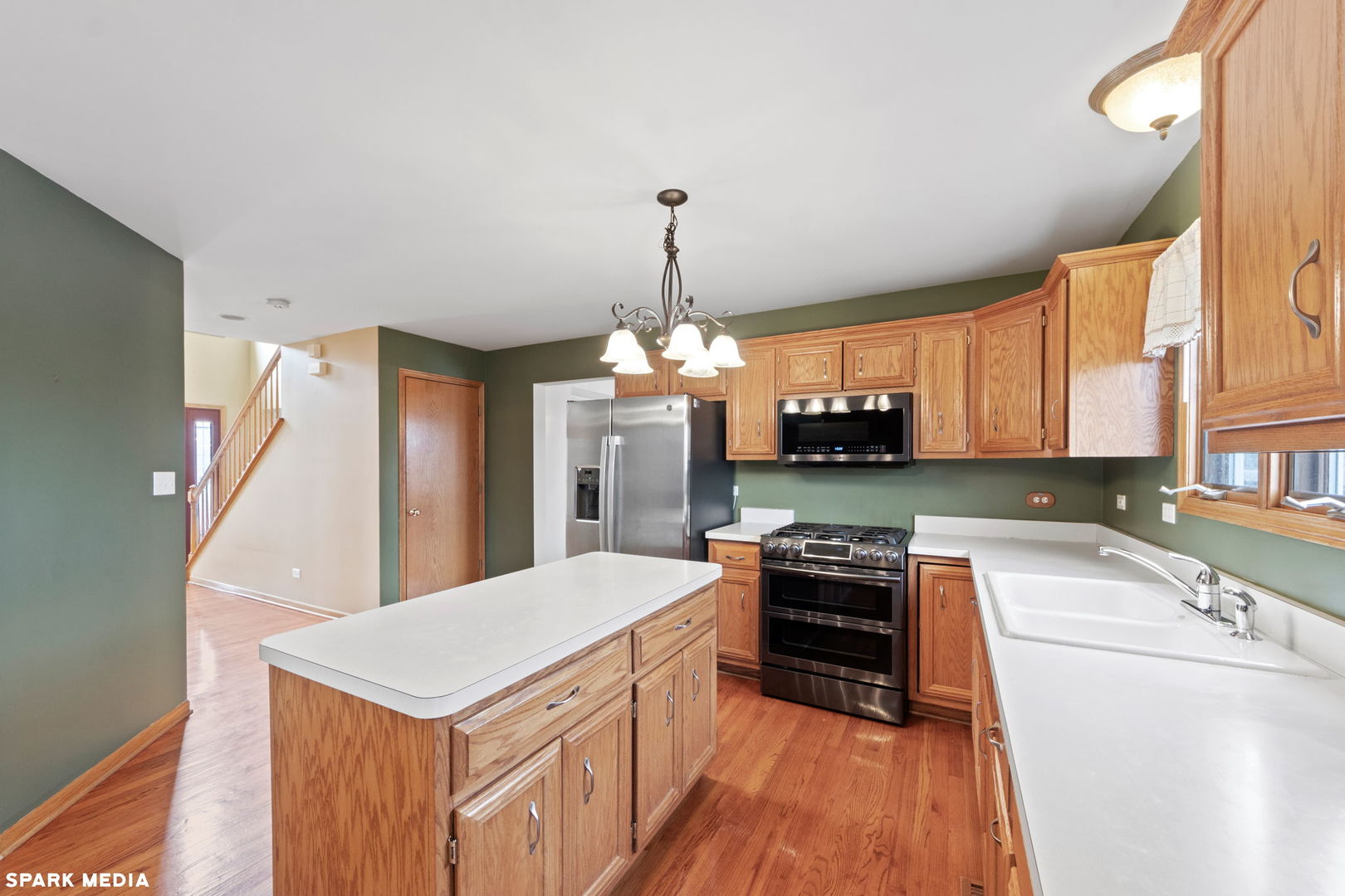 5642 Feather Creek Road Matteson, IL 60443 - Photo 10 of 36 a kitchen with kitchen island a counter top space a sink and appliances