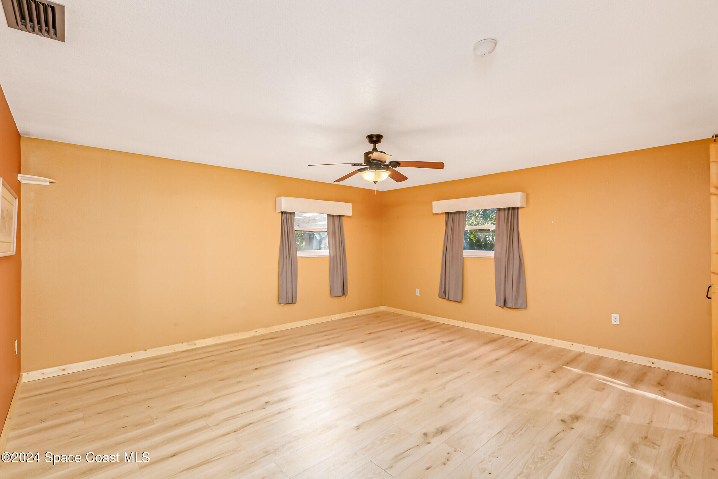 1235 Pine Island Road Merritt Island, FL 32953 - Photo 15 of 45 a view of an empty room with a window