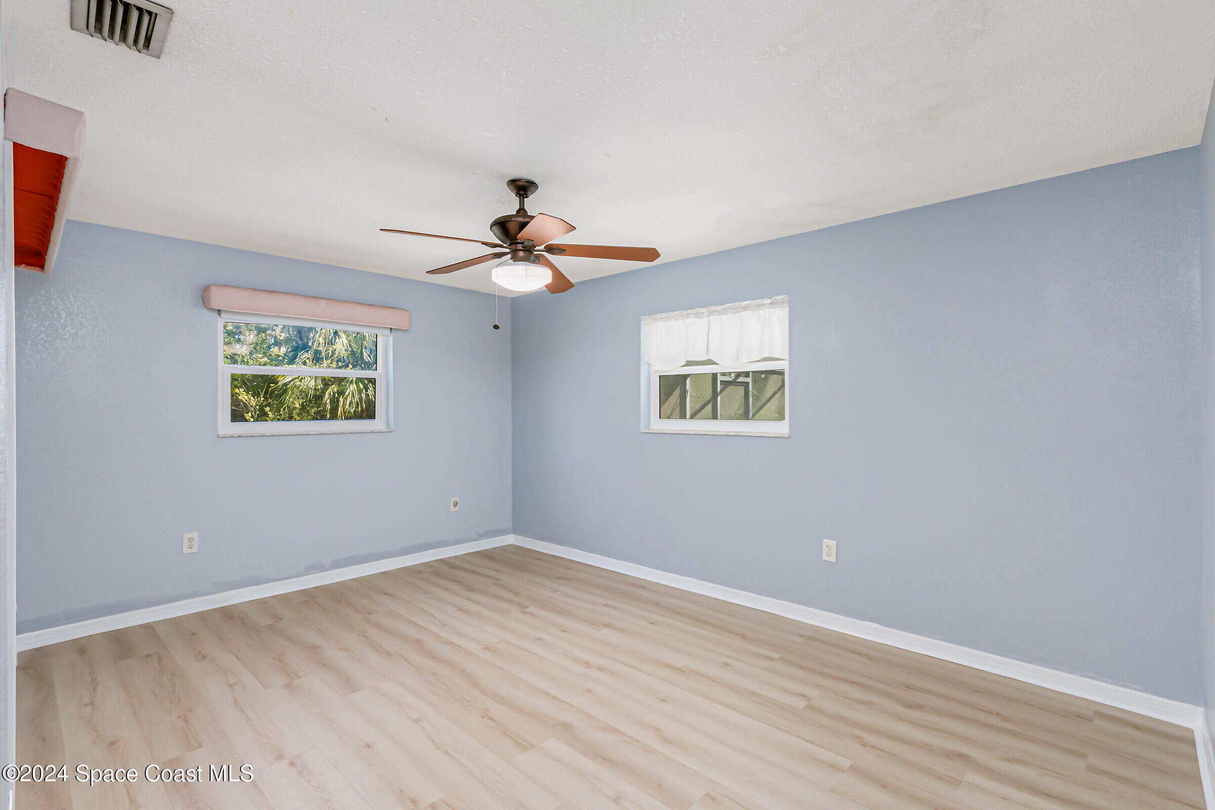 1235 Pine Island Road Merritt Island, FL 32953 - Photo 20 of 45 a view of empty room with wooden floor