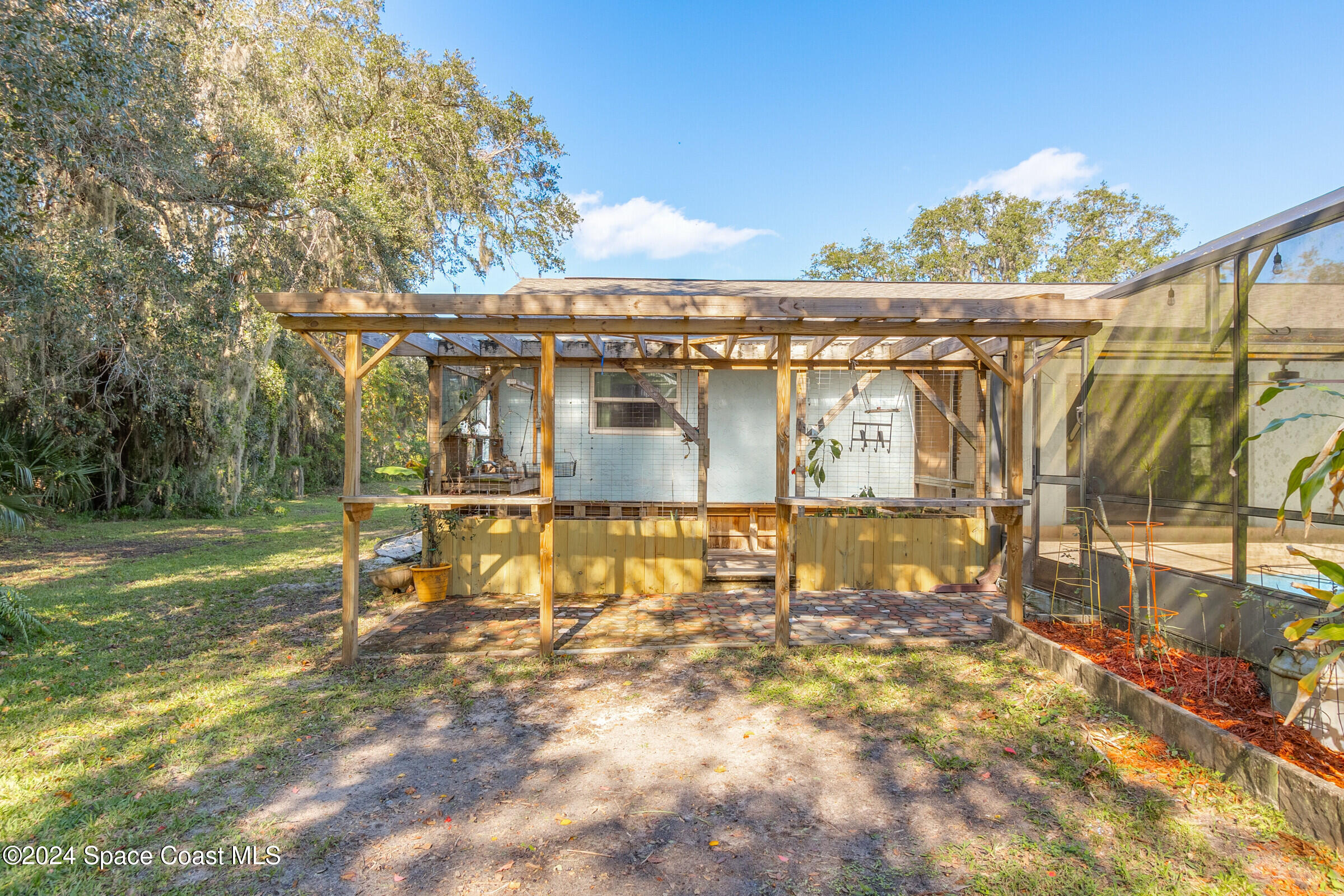 1235 Pine Island Road Merritt Island, FL 32953 - Photo 27 of 45 a view of a house with a yard