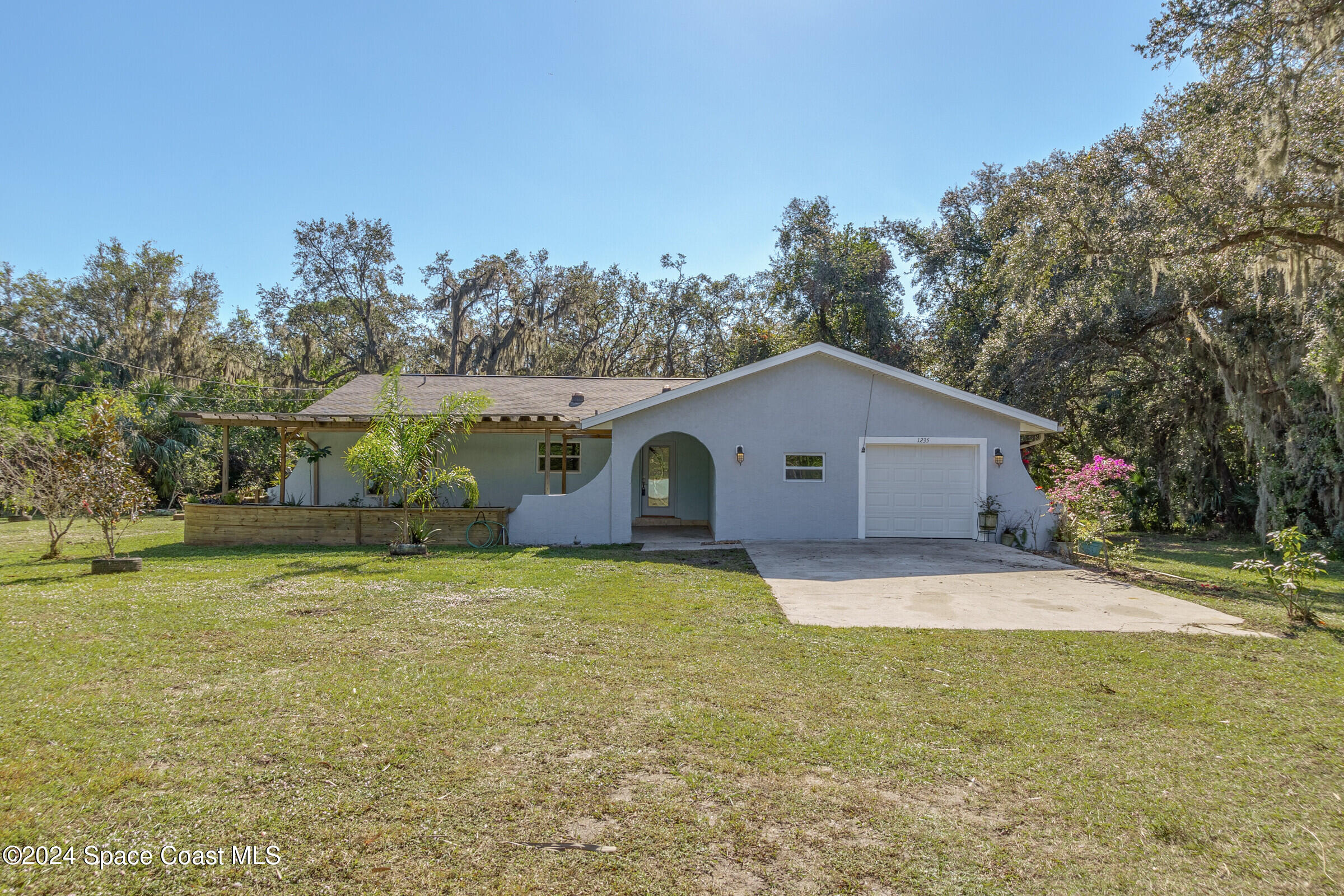 1235 Pine Island Road Merritt Island, FL 32953 - Photo 44 of 45 a house view with a outdoor space