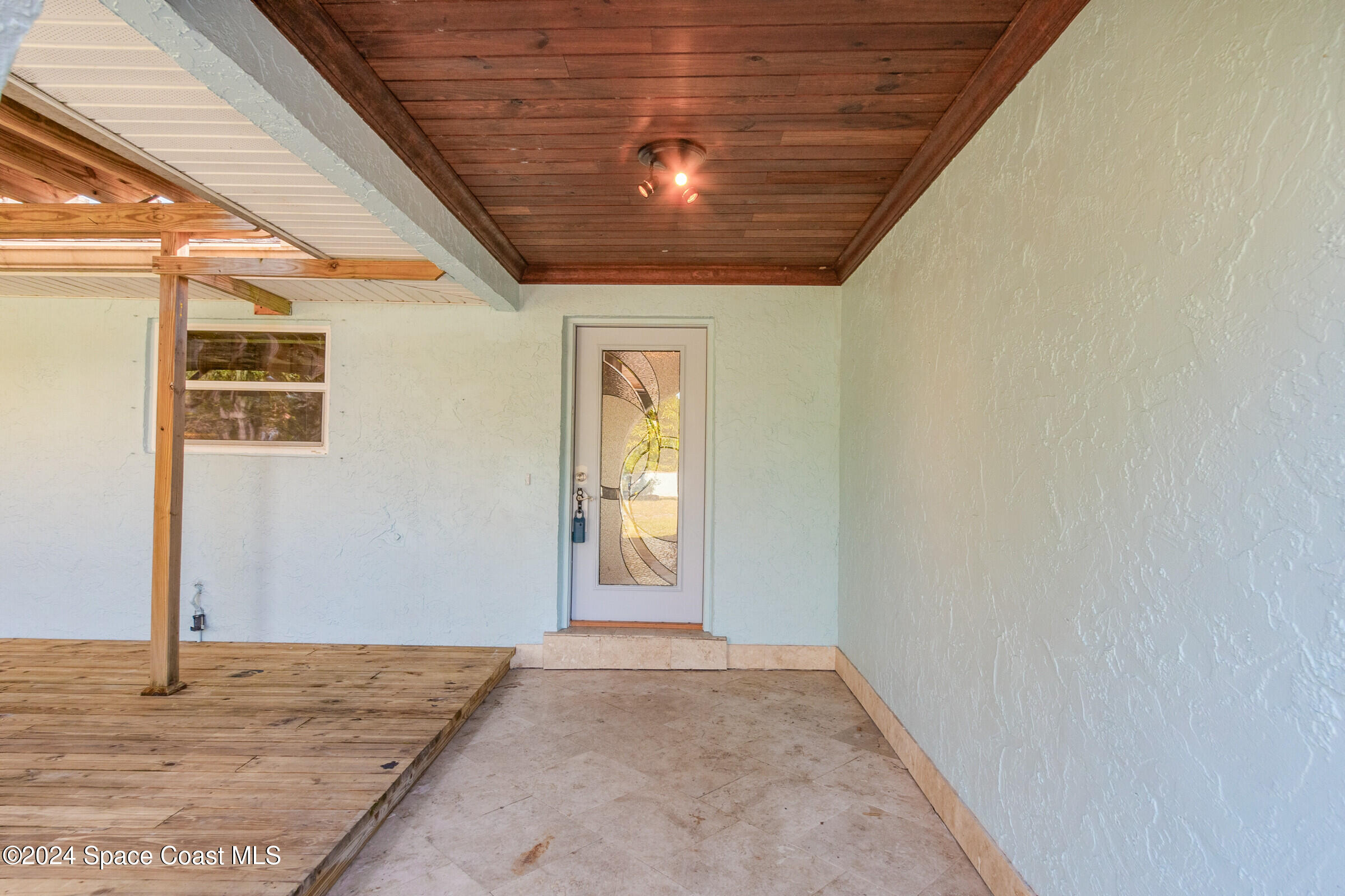 1235 Pine Island Road Merritt Island, FL 32953 - Photo 5 of 45 a view of an empty room with window