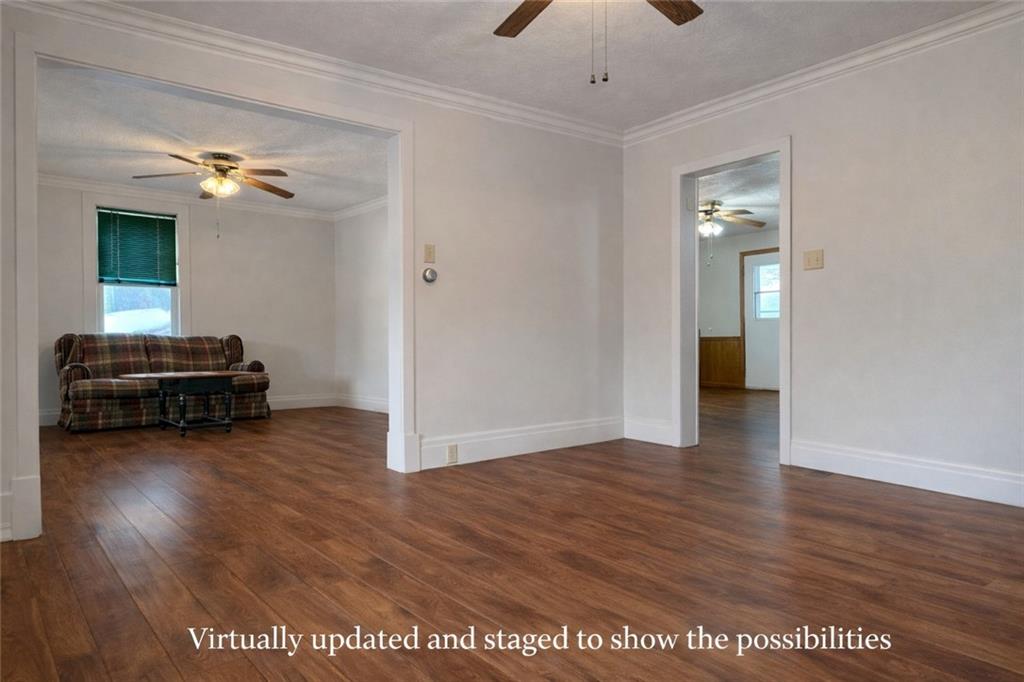 1126 Penn Avenue Vandergrift, PA 15690 - Photo 15 of 24 a view of livingroom with hardwood floor and a ceiling fan