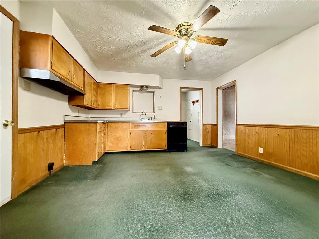 1126 Penn Avenue Vandergrift, PA 15690 - Photo 5 of 24 a view of a kitchen with microwave and cabinets