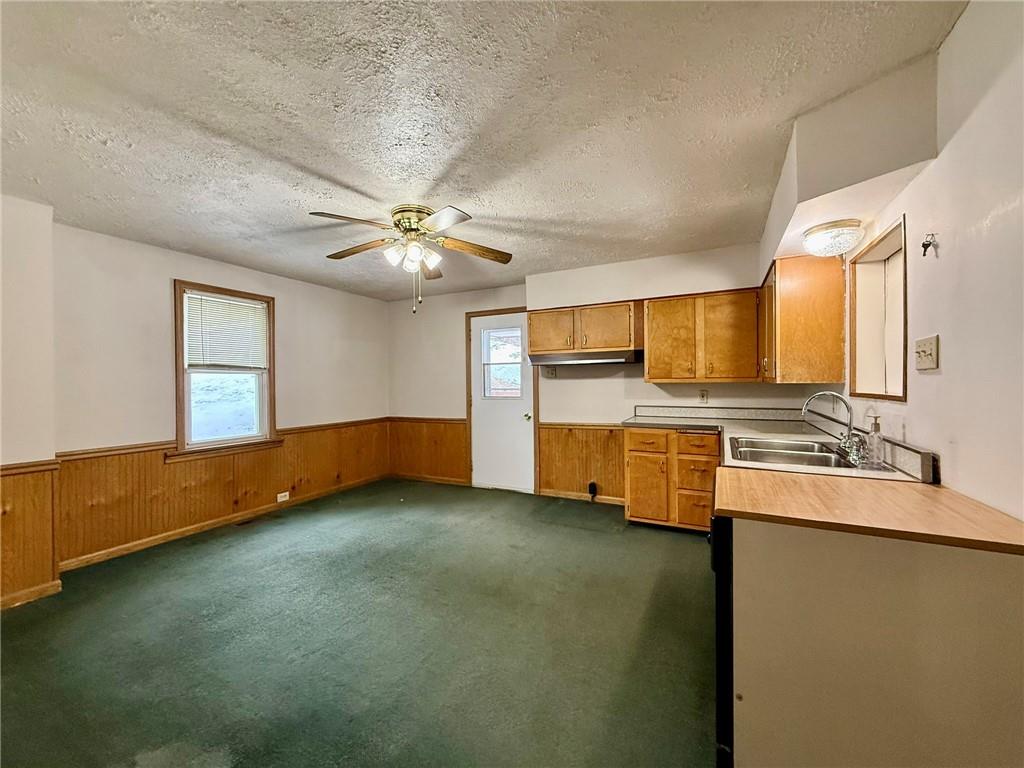1126 Penn Avenue Vandergrift, PA 15690 - Photo 6 of 24 a view of a kitchen with a sink cabinets and a kitchen