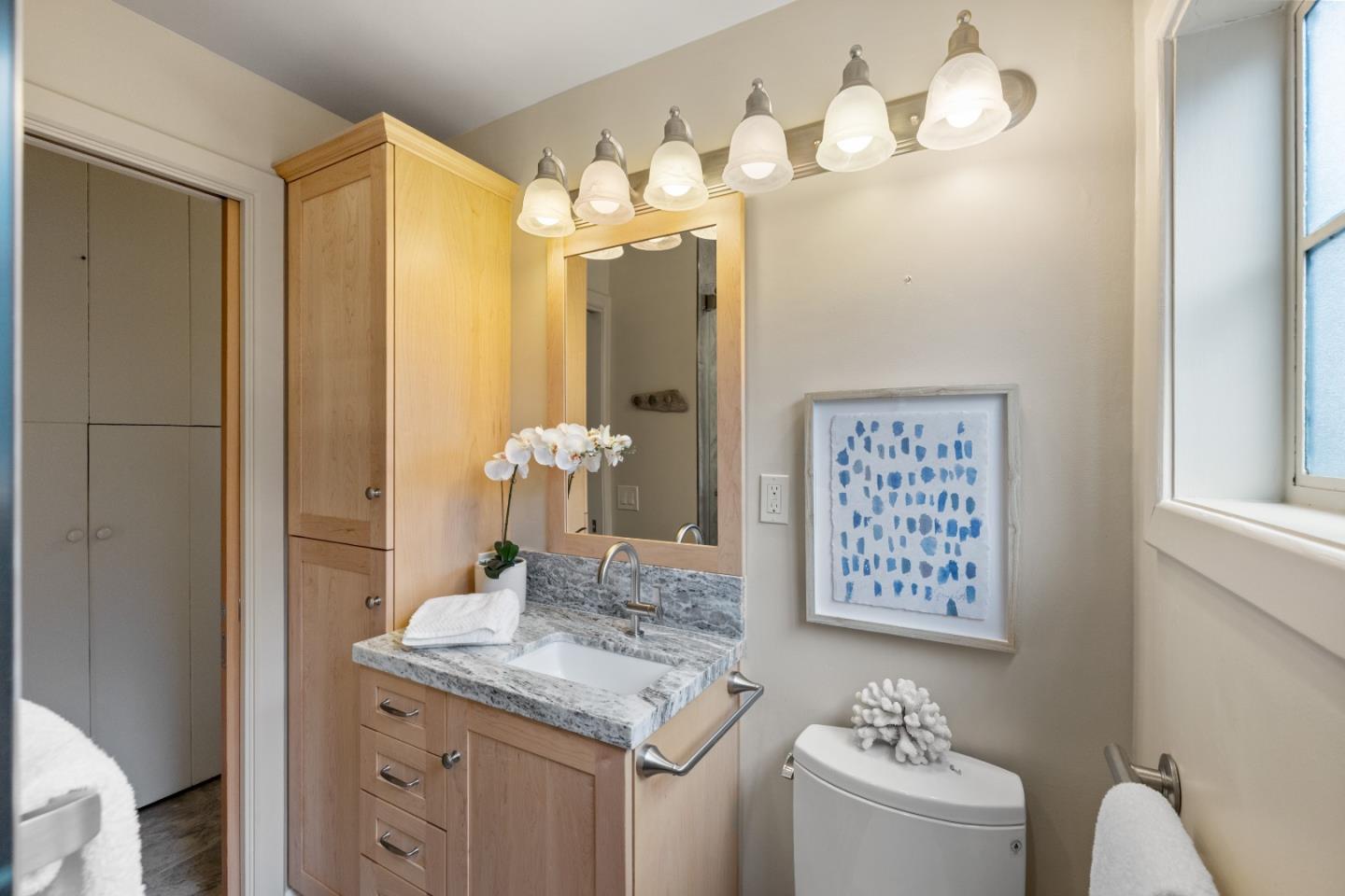 705 Grace Street Monterey, CA 93940 - Photo 12 of 28 a bathroom with a sink a vanity and a mirror