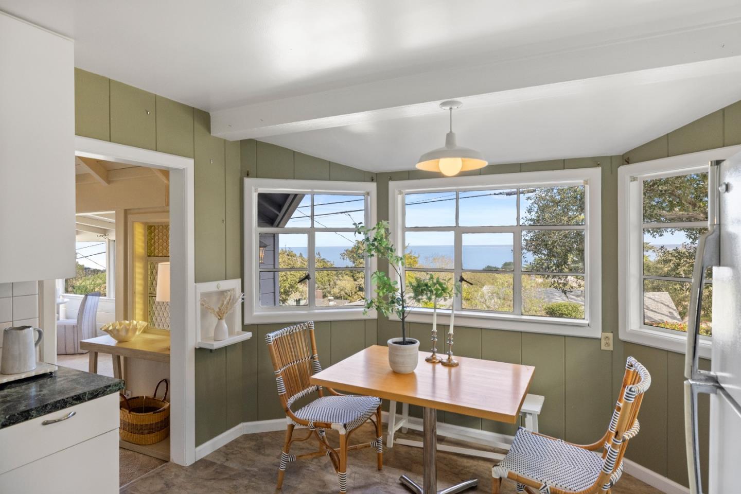 705 Grace Street Monterey, CA 93940 - Photo 5 of 28 a dining room with furniture a chandelier and wooden floor