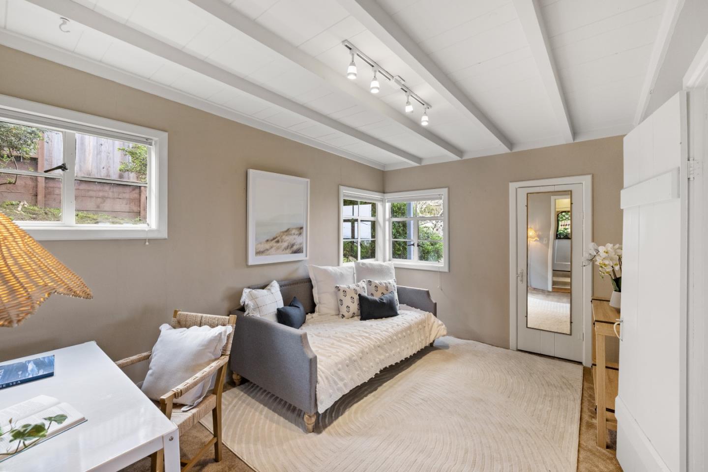 705 Grace Street Monterey, CA 93940 - Photo 10 of 28 a bedroom with a bed and wooden floor