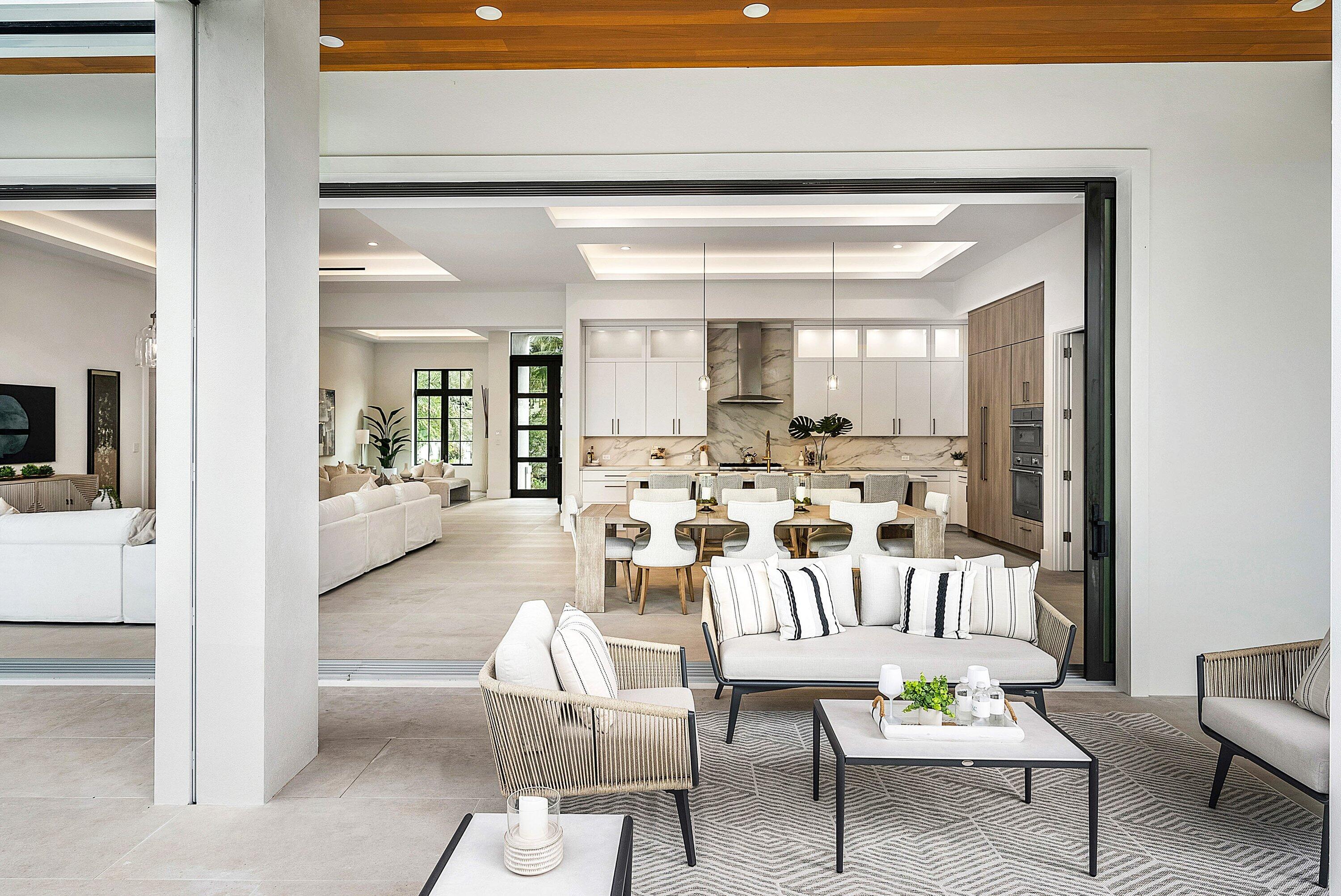 2609 Northeast 27th Way Fort Lauderdale, FL 33306 - Photo 16 of 53 a view of a dining room with furniture and a potted plant