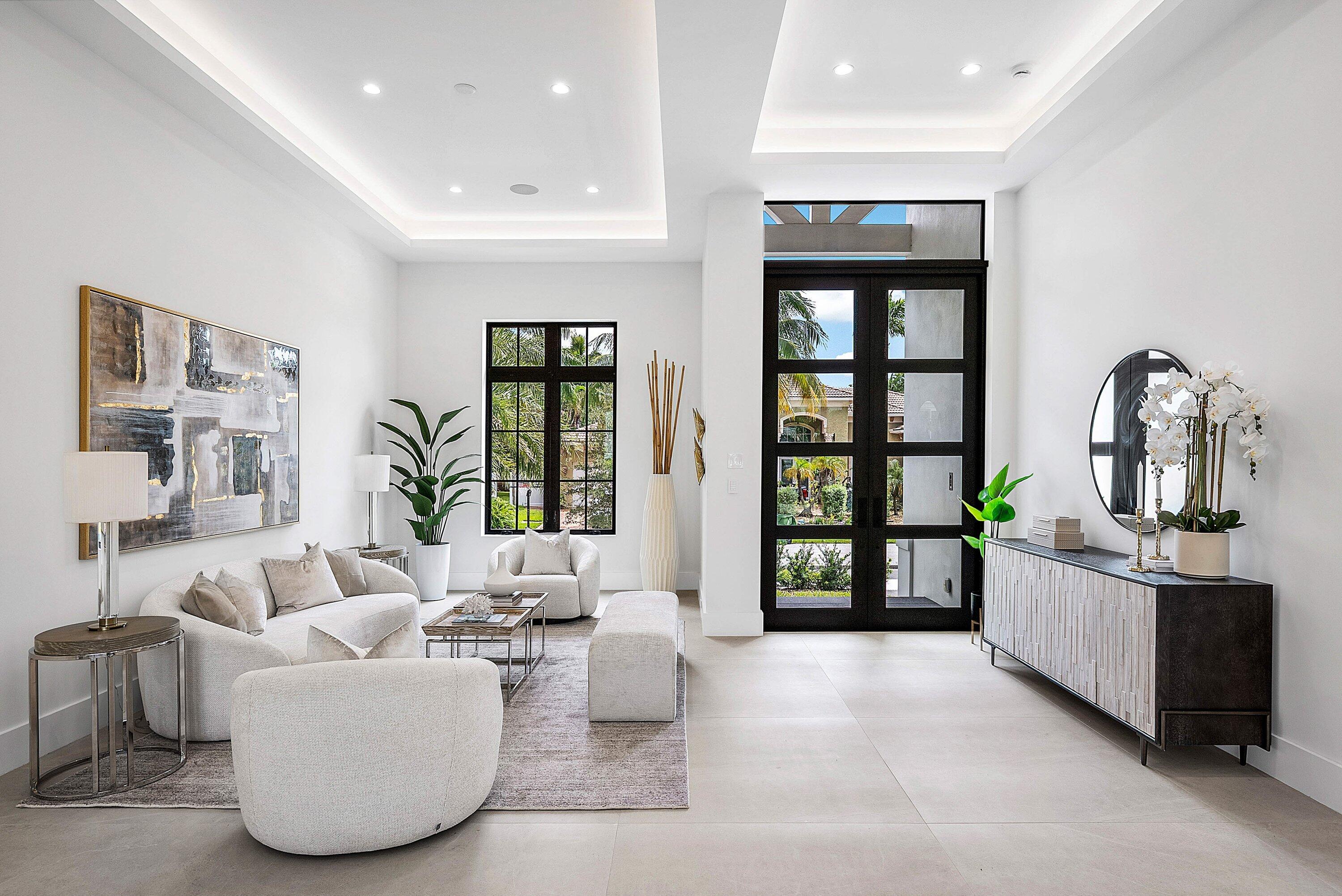 2609 Northeast 27th Way Fort Lauderdale, FL 33306 - Photo 3 of 53 a living room with furniture and large windows