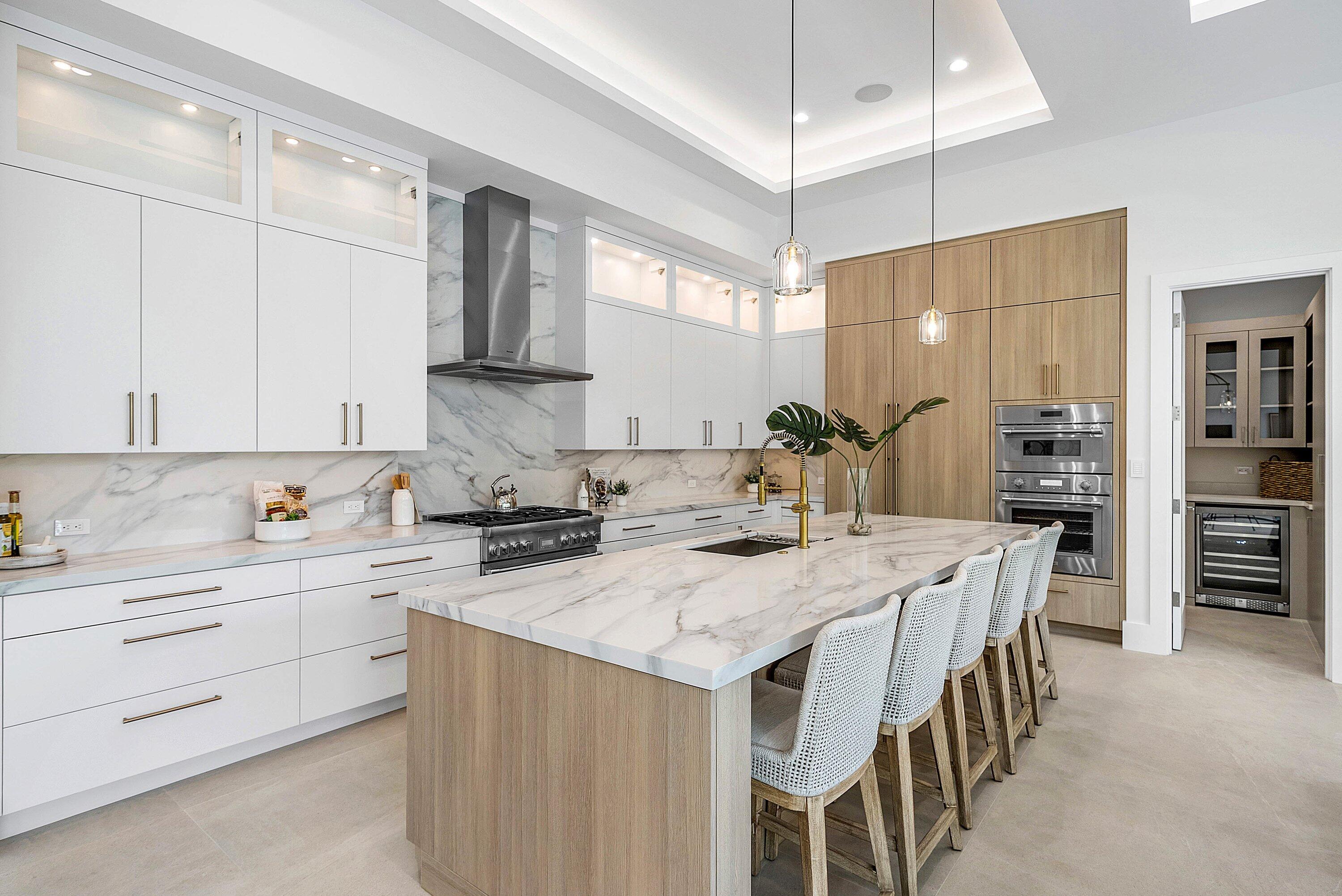 2609 Northeast 27th Way Fort Lauderdale, FL 33306 - Photo 8 of 53 a kitchen that has a lot of cabinets in it and appliances