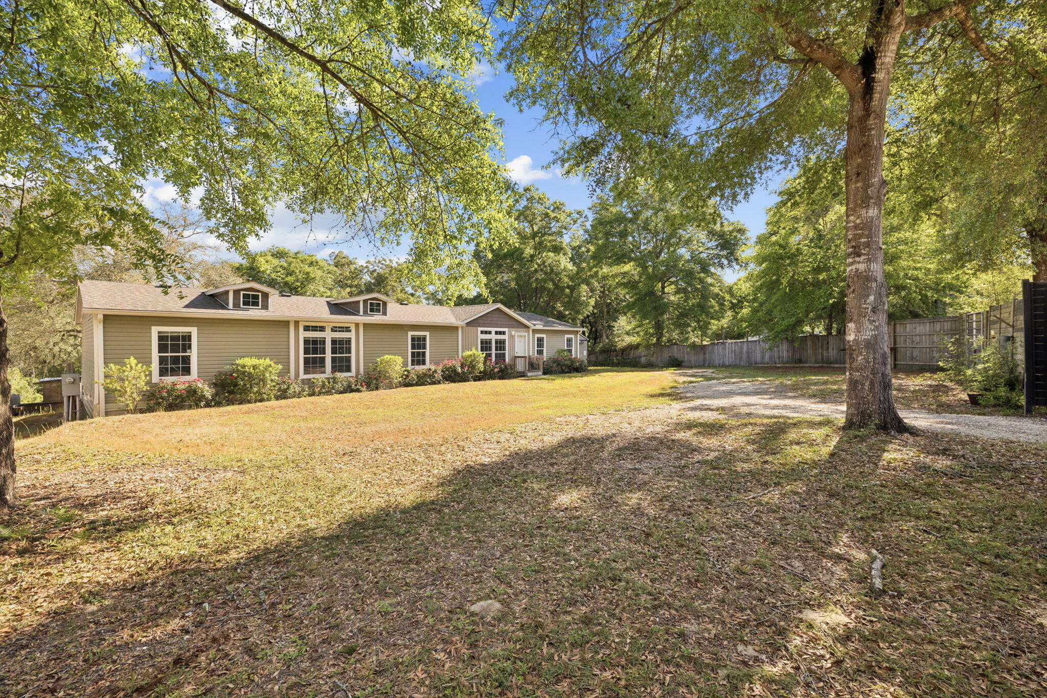 748 Phillips Drive Freeport, FL 32439 - Photo 1 of 32 a house with swimming pool in front of it