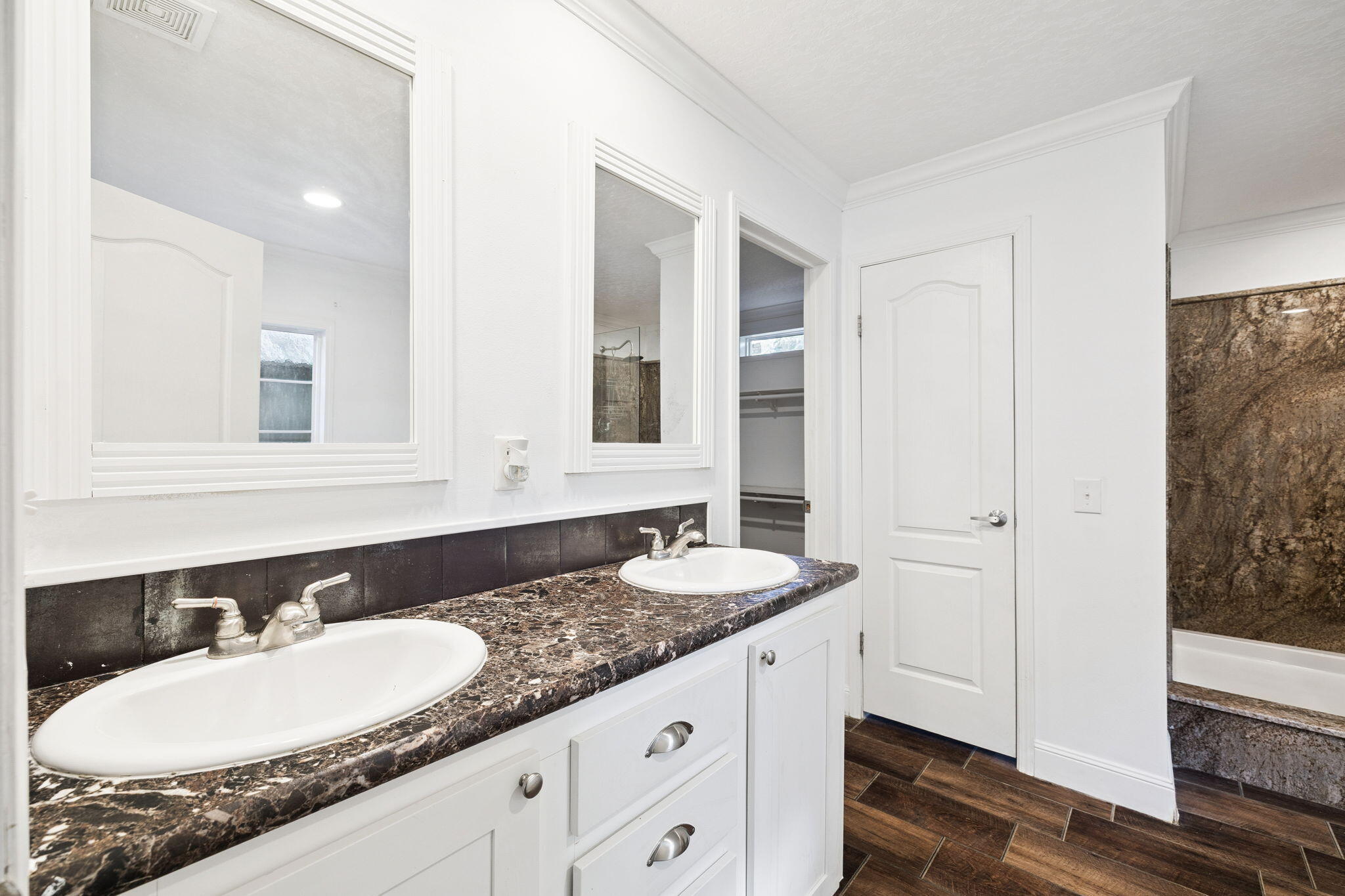 748 Phillips Drive Freeport, FL 32439 - Photo 15 of 32 a bathroom with a granite countertop double vanity sinks and a mirror