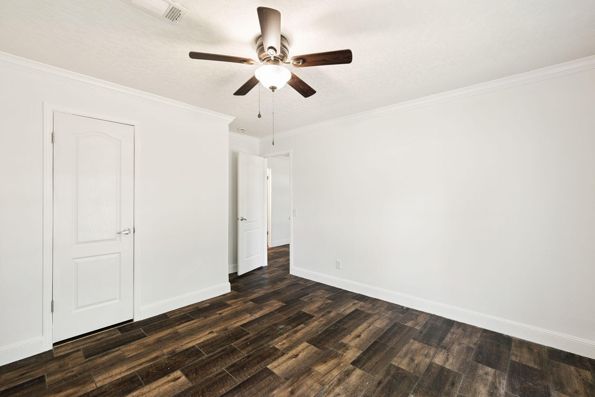 748 Phillips Drive Freeport, FL 32439 - Photo 23 of 32 a view of empty room with wooden floor