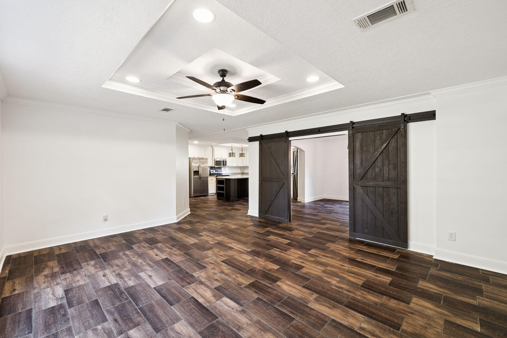748 Phillips Drive Freeport, FL 32439 - Photo 6 of 32 a view of a livingroom with a ceiling fan wooden floor and ceiling fan