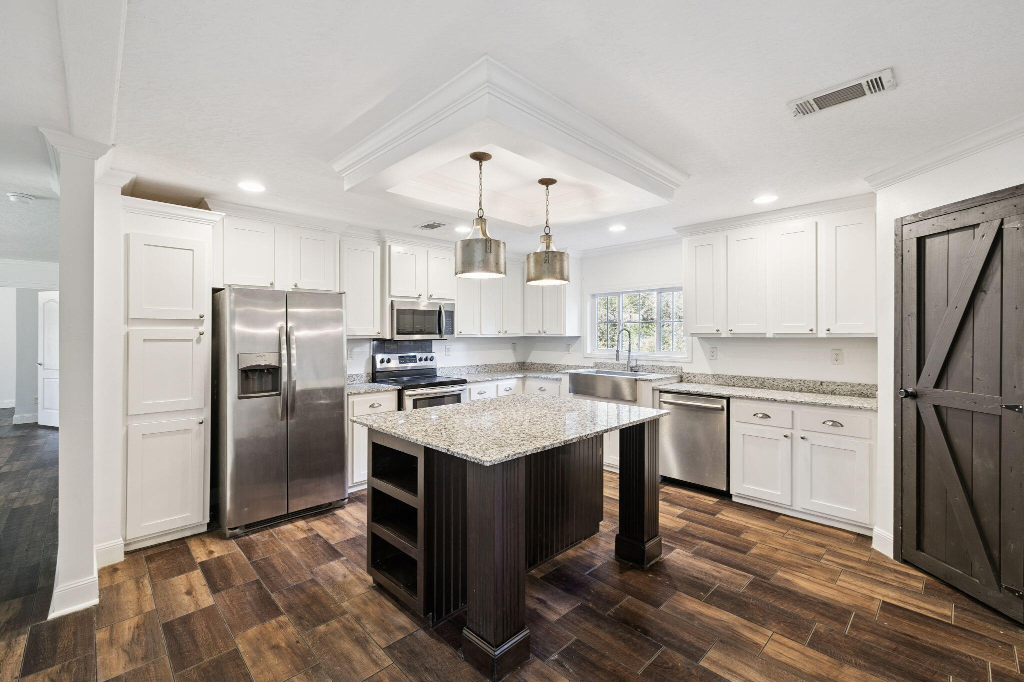 748 Phillips Drive Freeport, FL 32439 - Photo 8 of 32 a kitchen with a sink stainless steel appliances a refrigerator and cabinets