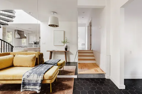 a bedroom with furniture and a window