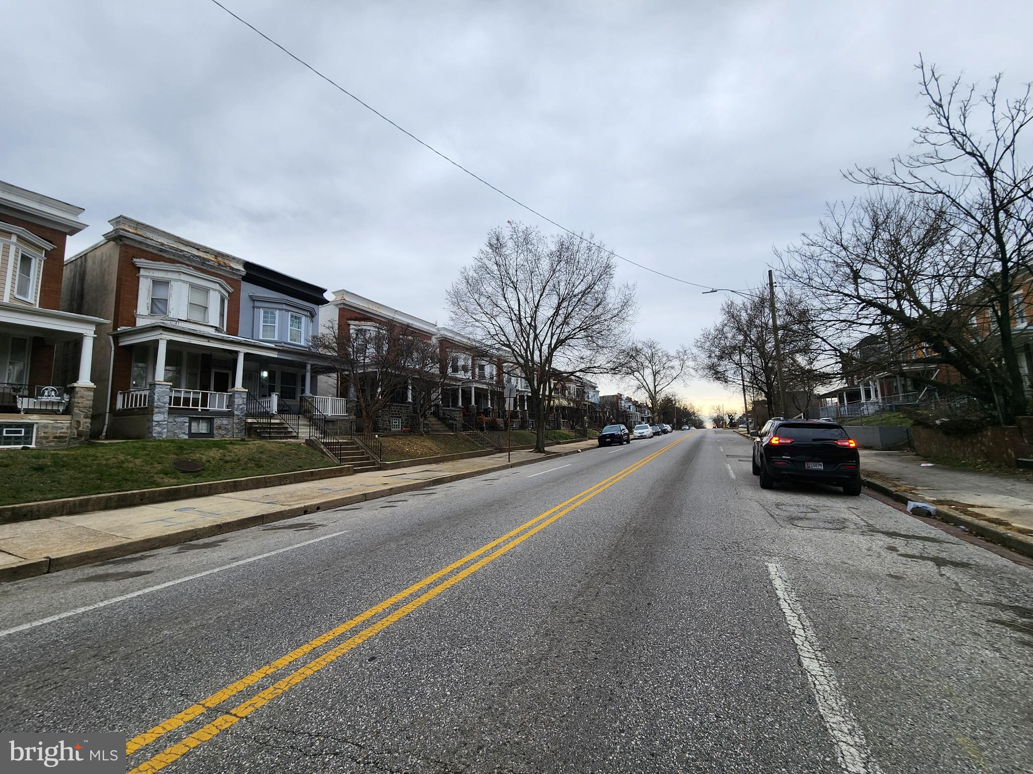 3714 Reisterstown Road Baltimore, MD 21215 - Photo 4 of 4 a view of a city street with a building