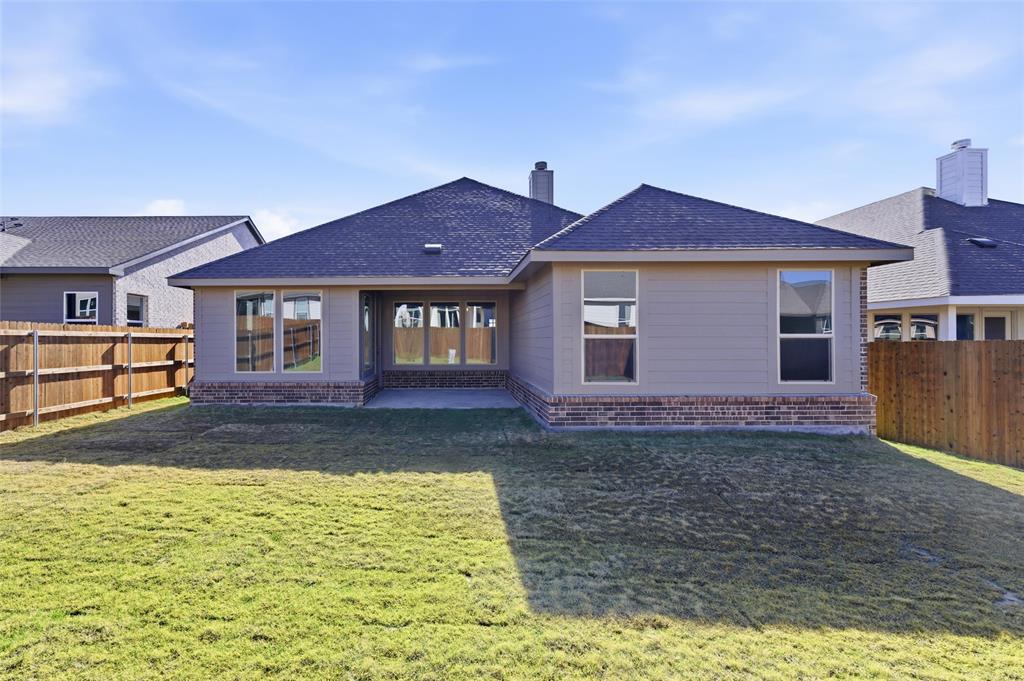 3513 Helena Street Gainesville, TX 76240 - Photo 20 of 25 a front view of a house with a yard