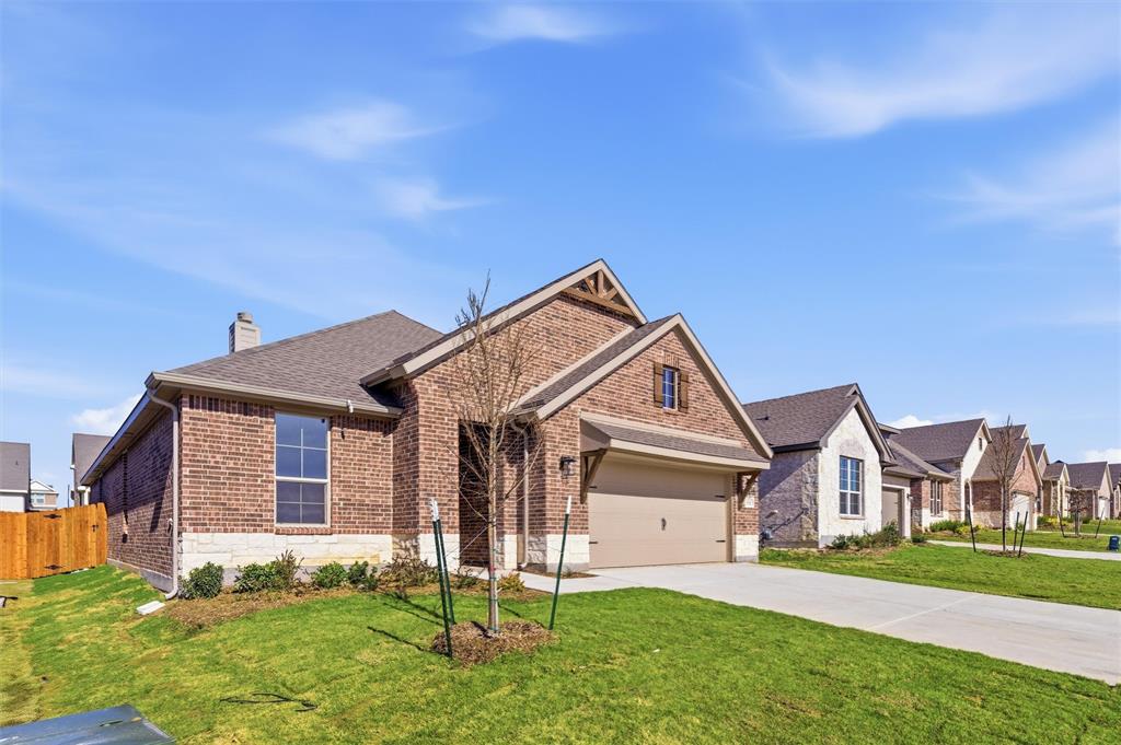 3513 Helena Street Gainesville, TX 76240 - Photo 2 of 25 a front view of a house with a yard