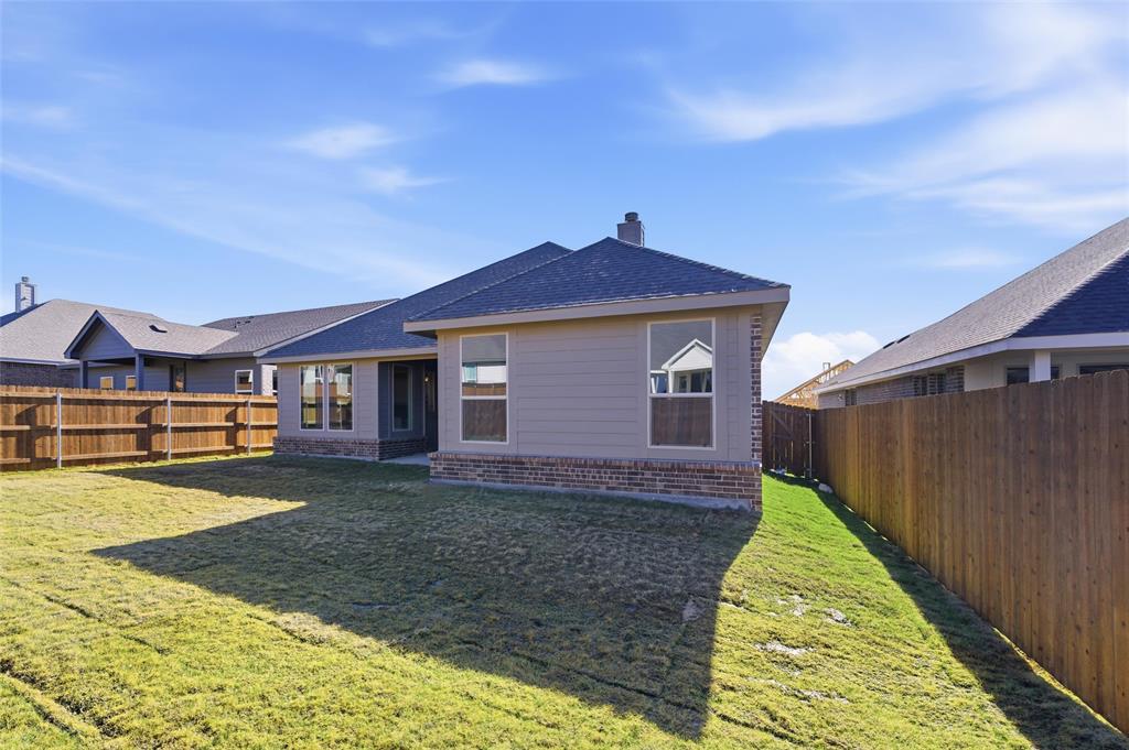 3513 Helena Street Gainesville, TX 76240 - Photo 21 of 25 a front view of a house with a yard