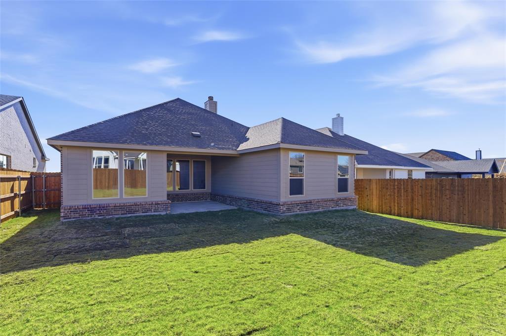 3513 Helena Street Gainesville, TX 76240 - Photo 23 of 25 a front view of a house with a yard
