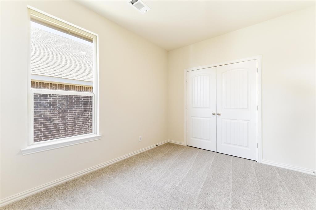 3513 Helena Street Gainesville, TX 76240 - Photo 7 of 25 a view of an empty room with a window