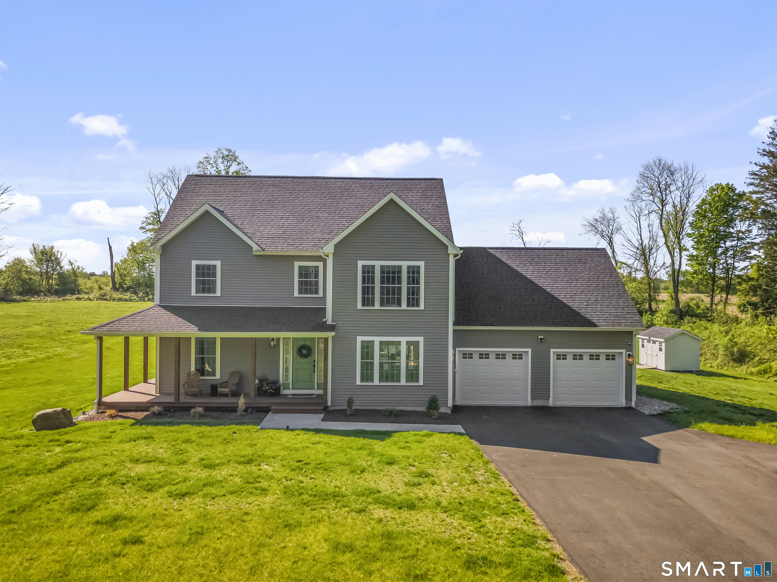 29 Beecher Road Brooklyn, CT 06234 - Photo 3 of 40 a front view of a house with a yard