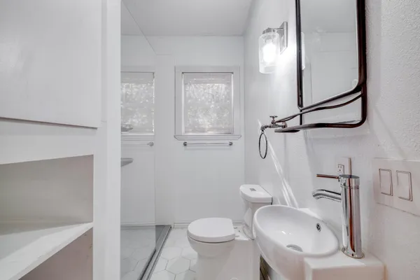 a view of an empty room with a window