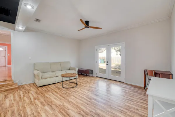 a living room with furniture and a window