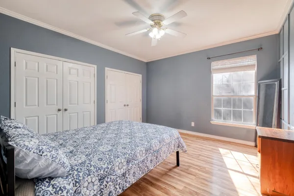 a view of a bedroom with closet and cabinet