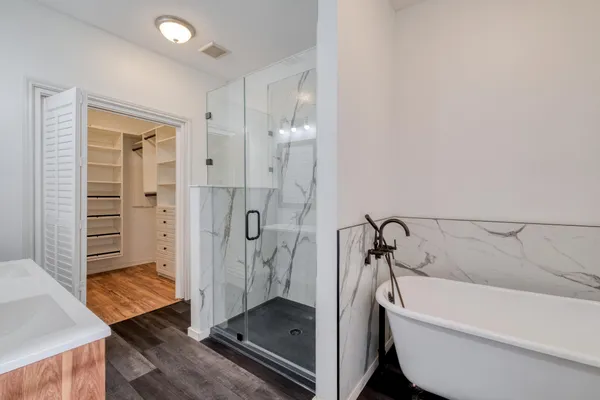 a bathroom with a sink a mirror and a vanity