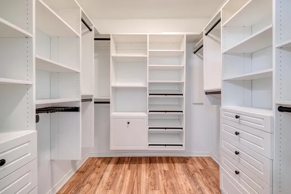 a bathroom with a shower a bathtub and a shower