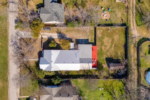 an aerial view of a houses with a outdoor space