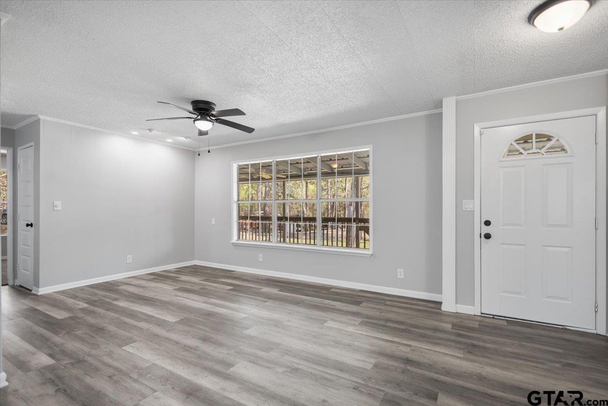 18607-c R 498 C R 498 Lindale, TX 75771 - Photo 10 of 41 a view of an empty room with a window and wooden floor